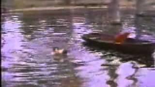 wetlook-A woman swims fully clothed wearing long dress