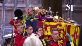 Queen Elizabeth's coffin lifted onto gun carriage as procession starts