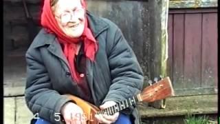 Old Woman Playing the Balalaika in Tver Region of Russia (1991)