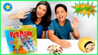 Kids play the KerPlunk Game. Challenge for kids.