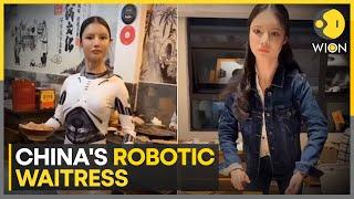 China's robotic waitress: Video of robot-like waitress serving food at a restaurant puzzles internet