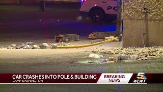 Car crashes into pole, building in Camp Washington