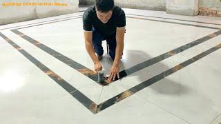 Professional Kitchen Floor Construction And Decoration Workers Cut And Decorate Ceramic Tile Borders