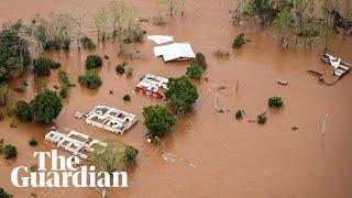 Floods submerge homes and leave at least 21 people dead in Brazil