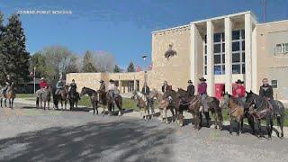 High school seniors ride horses to school as a prank on Montana principle