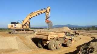 Big excavators on construction sites...Cat, Komatsu, Liebherr...