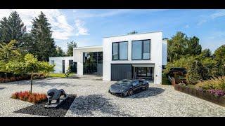 A Modern Bauhaus-Style Villa With A Car Lift That Disappears Into The Ground