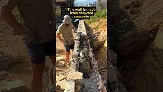 Stonemason places the final stones in a wall #mason #stonemason #retainingwalls