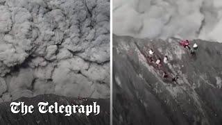 Moment climbers run for their lives as volcano erupts in Indonesia