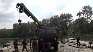 Construction of a road bridge that connects the liberated settlements across the river Seversky...