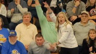 Over-Eager Mom Cheers on Her Son During Wrestling Match