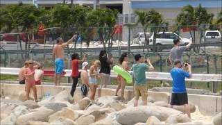 St.Maarten Airport Jet Blast!! Watch the girl with the green floaty!