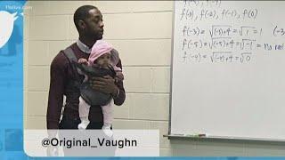 Morehouse professor holds baby so student can take notes in class