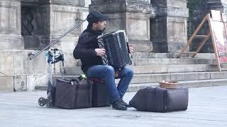 Street musician playing acordeon (Toccata by Bach)