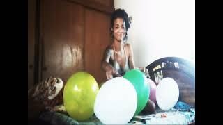 Balloon fun on her bed