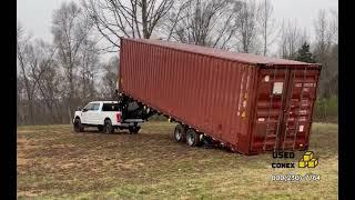 40ft shipping container delivery on a 40ft tilt-bed trailer.