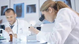 A medical research team working together, analyzing scan and pharmaceuticals - FREE STOCK FOOTAGE HD