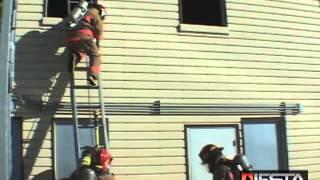 Operating a charged attack line from a ladder