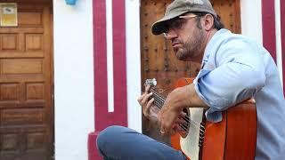 Flamenco Guitarist plays in the Streets of Spain