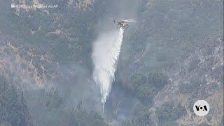 Helicopters drop water on wildfire in southern California | VOA News