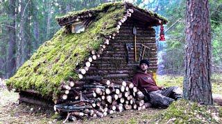 Building a log hut to survive in a wild forest. Bushcraft camping in the wild