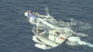 Libyan coast guard shoots at tiny boat full of migrants