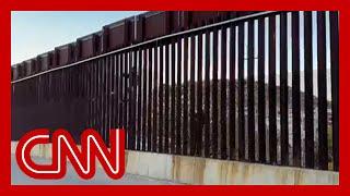 CNN cameras capture migrants attempting to scale southern border fence