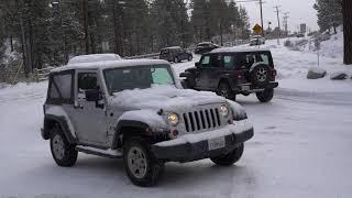 Cars sliding on Maple Lane after recent snowfall in Big Bear, CA