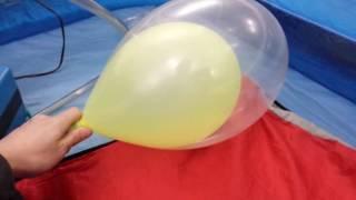 Neon balloon in balloon pump to pop
