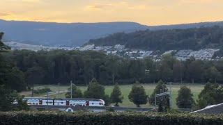 Swiss train glides through the sunset