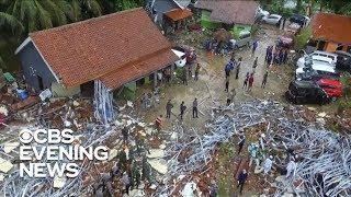 Officials in Indonesia search for victims as tsunami death toll rises