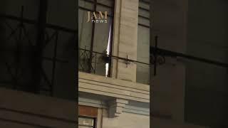 Judges look out of restaurant windows. Tbilisi / JAMnews English