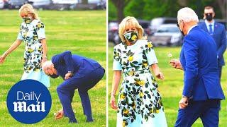 Cute moment Biden picks Jill a flower as they board Marine One