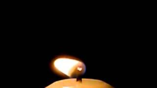 Slow motion video of candle flame blowing out