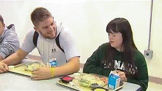 High School Football players form friendship with special needs kids