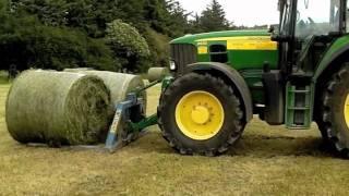 John Deere drawing baled silage