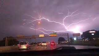 Lightning Spreads Across Sky over Highway Traffic - 1049406