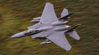 FIGHTER JETS SOARING THROUGH A RAIN-SOAKED MACH LOOP - 4K