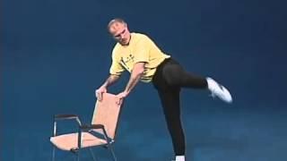 Superfoot Wallace training for high kicks with a chair