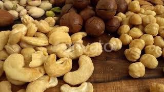 Assorted nuts on a wooden board. | Stock Footage - Envato elements