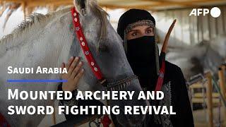 Saudi horsewoman revives 'buried' tradition of mounted archery and sword fighting | AFP
