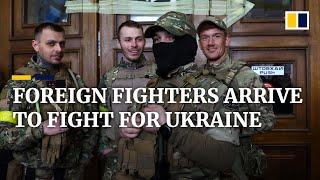 Volunteer foreign fighters arrive in Ukraine to fight Russian invasion