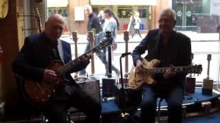 Carl Orr  (Billy Cobham) and Jim Mullen playing Lengardo guitars at Ivor Mairants - London - part 1