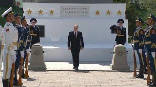 Putin visits Soviet martyrs monument during China trip | AFP