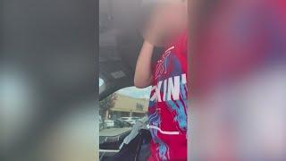 Viral video shows three children being rescued from hot car, mother facing charges