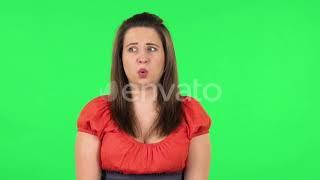 Portrait of Frightened Girl Says Wow with Shocked Facial Expression. Green Screen