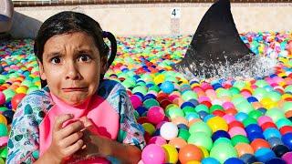 Ellie & Charlotte Ball Pit Shark Surprise in the Swimming Pool