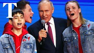 Putin sings Russian anthem with children at nationalist concert
