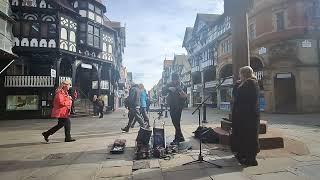 Chester city buskers Ed Alleyne-Johnson and Denyze D'Arcy.  Ed is playing 'Vagabonds'