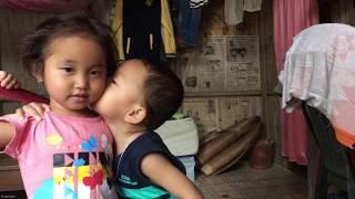 A Cute little boy kisses to a cute little girl.